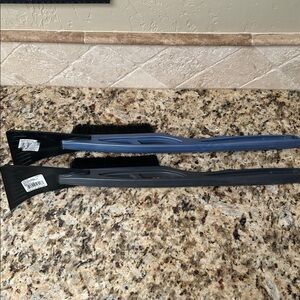 Two Black and Blue Car Snow Brushes